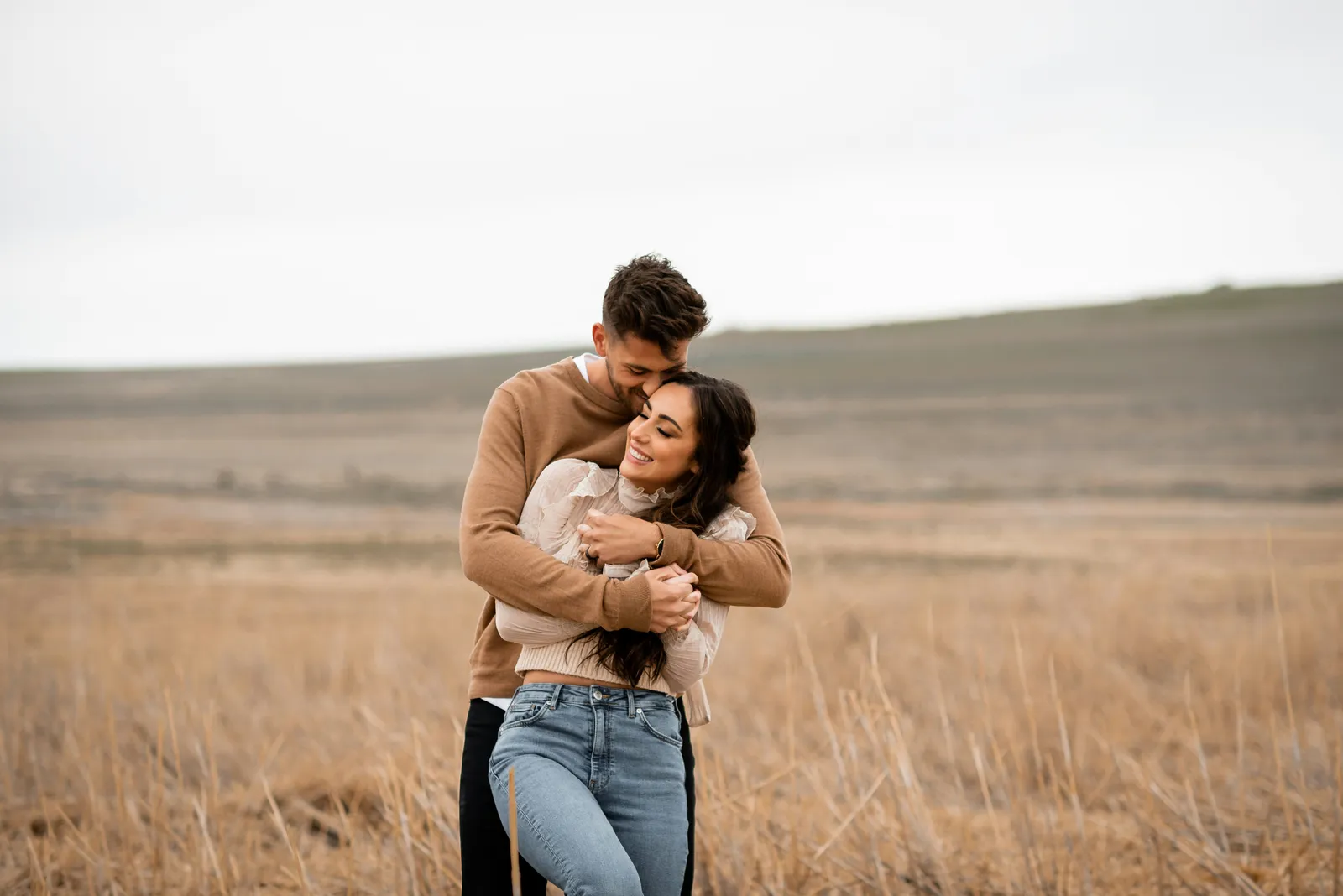 Couple embracing in a golden field